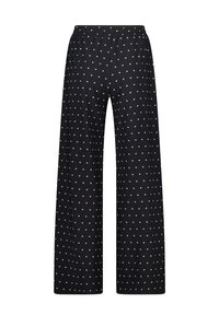 Black wide-leg pants with white polka dots, featuring an elastic waistband and soft fabric texture. Suitable for casual wear.