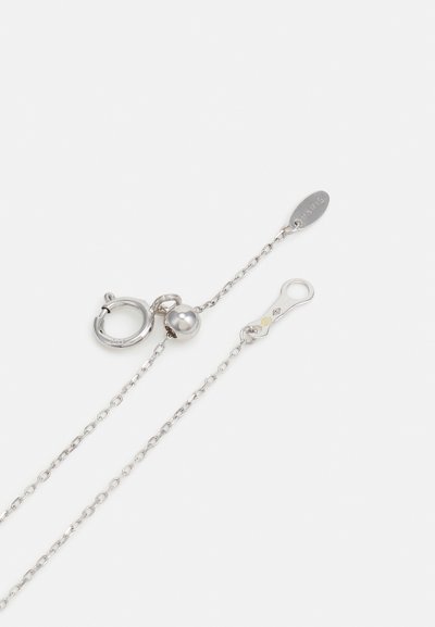 Silver necklace chain with a round clasp, featuring a small spherical accent and an oval tag. The links are uniform and smooth.