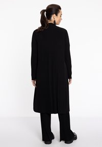 YOEK MIT DRUCK - Vest - black