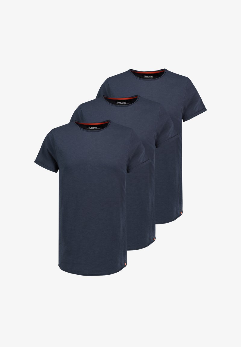 Navy blue cotton t-shirts with short sleeves, round neck, subtle texture, and red accent tags at the hem. Pack of three.