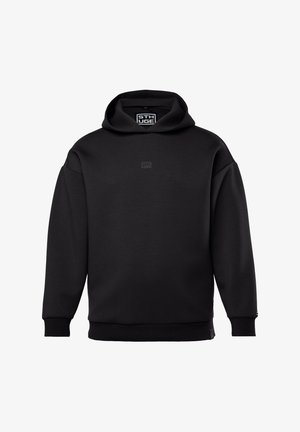 Haut à capuche noir en mélange de coton doux. Doté d'une capuche spacieuse, de poignets côtelés et d'un petit logo à l'avant. Design minimaliste.