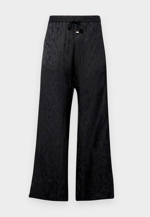 Black wide-leg pants with a textured leopard pattern, featuring an elastic waistband with a drawstring. Smooth, shiny fabric with a relaxed fit.