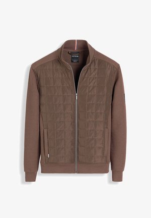 Bruine ritsjack met een geborduurde voorkant, geribbelde kraag en gestructureerde mouwen. Inclusief zijzakken en een subtiele branding detail.