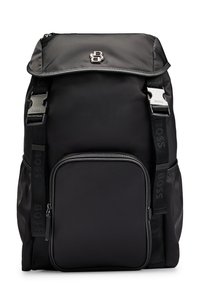 Black nylon backpack with a top flap, front zipper pocket, and adjustable straps. Features silver hardware and a textured logo accent.