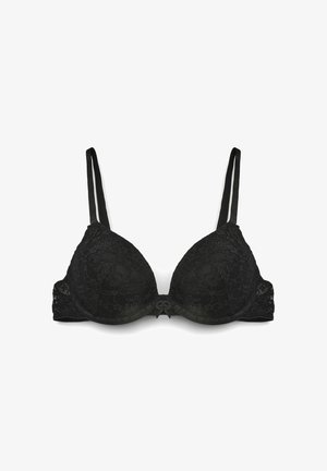 Reggiseno imbottito in pizzo nero con spalline regolabili e piccolo fiocco decorativo al centro davanti.