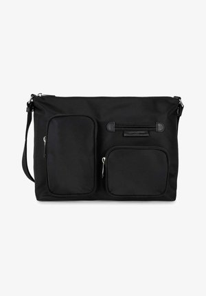 Black crossbody bag with adjustable strap, two front zippered pockets—one tall and rectangular, one smaller and square.
