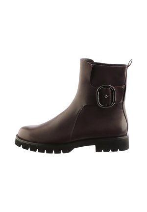 Brown leather ankle boots with a rounded toe, chunky black sole, and a buckle accent on the side. Smooth texture and minimal design.