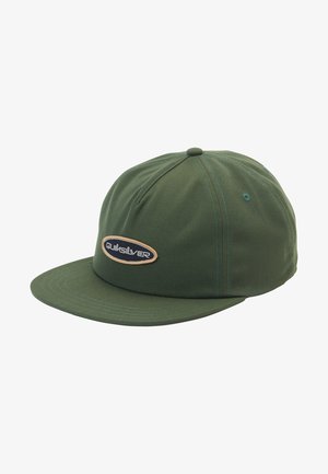 Green cap made of fabric with a structured brim, featuring a stitched logo patch in an oval shape and contrasting thread accents.