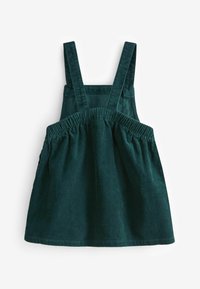 Salopette en velours côtelé vert foncé avec de larges bretelles et une taille élastique froncée pour enfant.