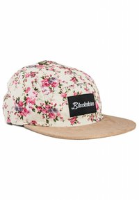 Floral cap with a cream fabric, pink and lavender flowers, soft tan brim, and a black label reading "Blackskies" stitched on the front.
