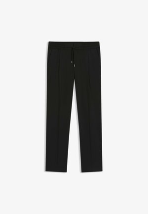 Svarta byxor i mjukt tyg med elastisk midja och dragsko, sidofickor och raka ben.