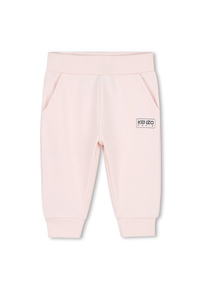 Pantaloni sportivi rosa chiaro realizzati in tessuto morbido, con vita e polsini a costine, due tasche laterali e una toppa con il logo KENZO applicata.