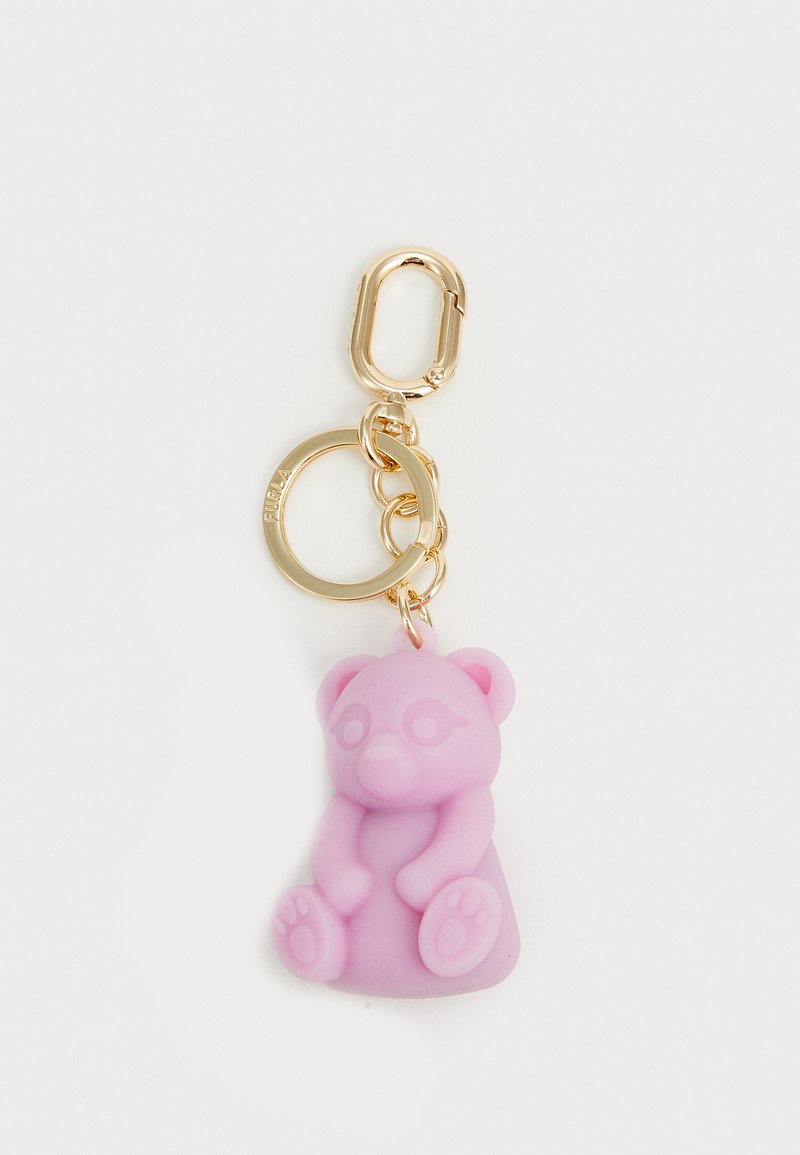 Ružičasti silikonski privjesak u obliku medvjedića, detaljan s okruglim ušima i šapama, pričvršćen na zlatni metalni prsten i kopču, glatke teksture.