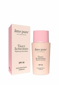 Gewichtslose Gesichtscreme in einer runden beigen Flasche mit einem pinken Deckel, präsentiert in einer passenden beigen Box. Der Text hebt den SPF 30 und die antioxidativen Eigenschaften hervor.