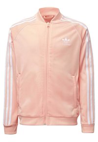 Vaaleanpunainen Adidas-urheilutakki, jossa on koko matkalta vetoketju, resorit kauluksessa ja hihojen suissa, kaksi sivutaskua sekä valkoiset kolmen raidan yksityiskohdat hihoissa.