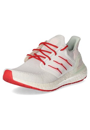 Chaussure de course blanche avec semelle rouge, lacets rouges et semelle intermédiaire blanche, dotée d'une tige en maille et d'une cage latérale en plastique de soutien.