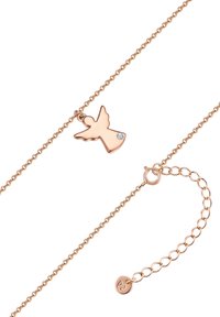 Rozā zelta kaklarota ar mazu eņģeļa kulonu, kas rotāts ar vienu caurspīdīgu akmeni. Smalka ķēdīte ar regulējamu garumu un aizdari.