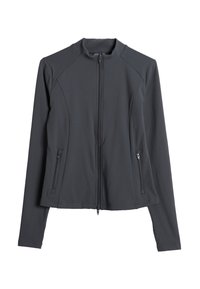 Veste à manches longues gris foncé avec fermeture éclair frontale et deux poches latérales zippées, dotée d'une coupe ajustée sans col.