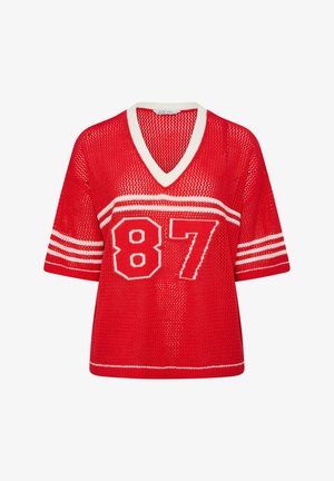 Rode gebreide korte mouw trui met witte V-hals afwerking, witte strepen op de mouwen en een groot nummer "87" met witte rand op de voorkant.