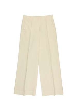 Beżowe spodnie o szerokich nogawkach z przednimi kieszeniami, szlufkami na pasek i zamkiem błyskawicznym z przodu, prezentowane na białym tle.