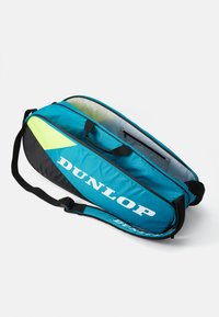 Dunlop-Tasche in Blau und Schwarz mit gelben Akzenten. Hergestellt aus robustem Material, verfügt über einen Schultergurt und einen Reißverschluss.