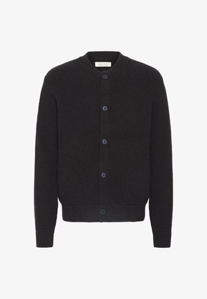 Tumehall ribakardin ümmarguse kaelusega, nööpide sulgemisega, kahe esi-taskuga ning ribadega mansettide ja äärega. Pehme kudumismaterjal.