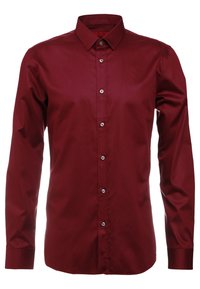 Camisa de manga larga burdeos en tejido suave que cuenta con un cuello tradicional, cierre frontal con botones y seis botones, y puños abotonados.