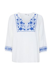 Blusa bianca leggera con scollatura a V e maniche 3/4. Presenta ricami floreali blu lungo il colletto e i polsini.