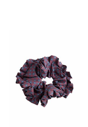 Purple fabric scrunchie with blue floral pattern and ruffled edges on a white background.