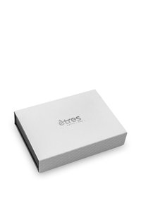 White rectangular box with a textured surface and embossed logo. The design is sleek with a simple, minimal aesthetic.