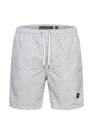 Hvide badetights med et bølgedesign i sort, med elastisk talje og snor, samt et lille logo-patch på den nederste kant.