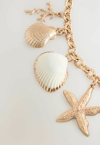 Next SHELL CHARM - Kaulakoru - gold tone