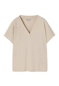 T-shirt beige à col en V avec des manches courtes. Présente une broderie florale sur le côté gauche et un tissu doux et texturé. Coupe décontractée.