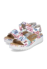 Sandales multicolores avec de larges brides croisées, semelle blanche et semelle intérieure texturée. Le motif présente des éclaboussures de rose, bleu et jaune.