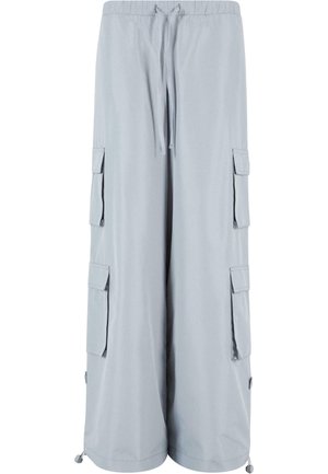 Pantalones cargo de color gris claro con cinturilla elástica, cierre con cordón, bolsillos laterales y dobladillos ajustables. Fabricados con una tela suave y ligera.