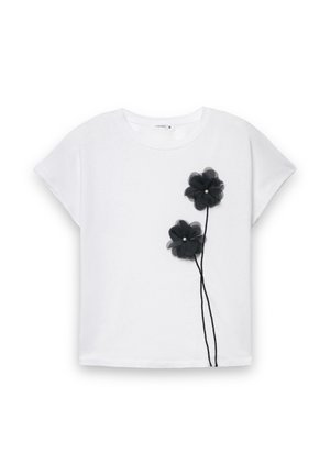 T-shirt bianca con due applicazioni di fiori in tulle nero con centri di perle, maniche corte e vestibilità morbida.