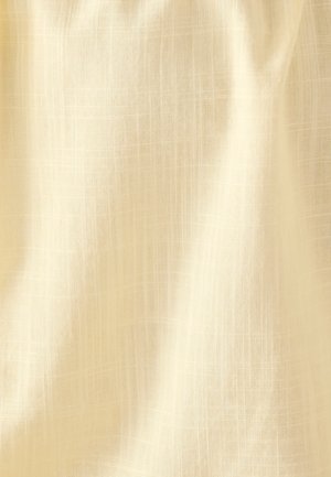 Tissu en lin beige avec une texture en croisillons subtile et des plis doux.