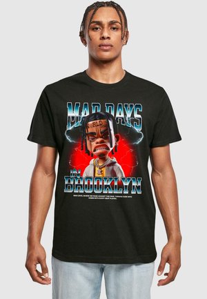 Black cotton t-shirt featuring a cartoon graphic of a character with cartoonish facial features, text "MAD DAYS IN BROOKLYN," and colorful accents.