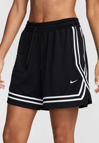 Black athletic shorts made of soft fabric, featuring contrasting white side stripes, an elastic waistband, and a small Nike logo.