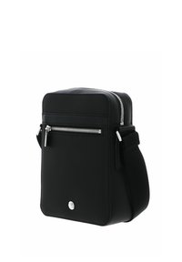 Black rectangular crossbody bag made of textured fabric, featuring a front zip pocket, silver hardware, and an adjustable strap.