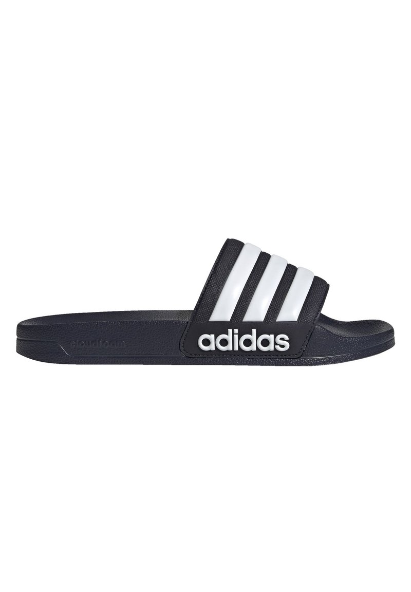 Black slide sandal with three white stripes and "adidas" logo. Made from soft material with a textured surface, featuring a contoured footbed.