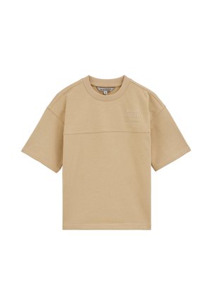 T-shirt beige à manches courtes et col rond avec le texte « BLUE RIDGE » sur la poitrine en haut à gauche, couture visible traversant la poitrine.