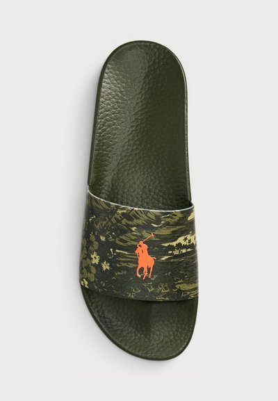 Green slide sandal with a textured footbed and a patterned strap featuring a floral design and an orange polo player logo.