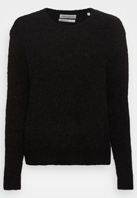Pull noir en tricot avec encolure ronde, tissu texturé, manches longues, poignets et ourlet côtelés. Étiquette visible au niveau du cou.