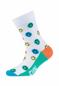 Calzini bianchi con motivi di faccine sorridenti multicolori, con dettagli verde e arancione sul tallone e sulla punta, caratterizzati dalla parola "DIVERTIMENTO" in teal.