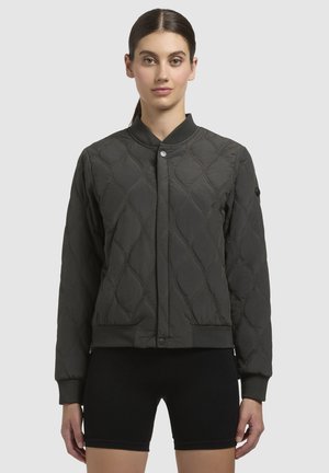 Quilted bomber jacket in dark green, featuring a snap closure, ribbed cuffs, and a fitted hem. Smooth fabric with a textured diamond pattern.