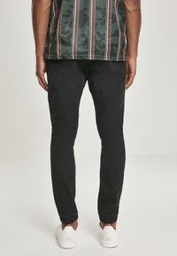 Southpole STRETCH JOGGER  - Treniņtērpa apakšdaļas - black