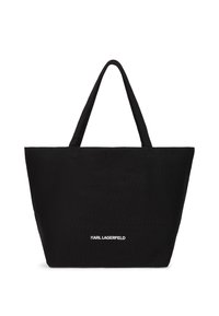 Black tote bag crafted from textured fabric, featuring two sturdy handles and a white "KARL LAGERFELD" logo at the bottom center.