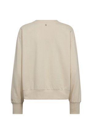 Bežs džemperis ar brīvu piegriezumu, ribotām aprocēm un apakšmalu, kā arī mazu logotipa detaļu aizmugurējā kakla daļā. Mīksts audums ar gludu tekstūru.