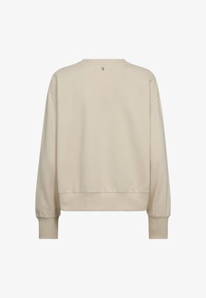 Sudadera beige de corte relajado, con puños y dobladillo de canalé, y un pequeño detalle del logo en la nuca. Tejido suave con una textura lisa.